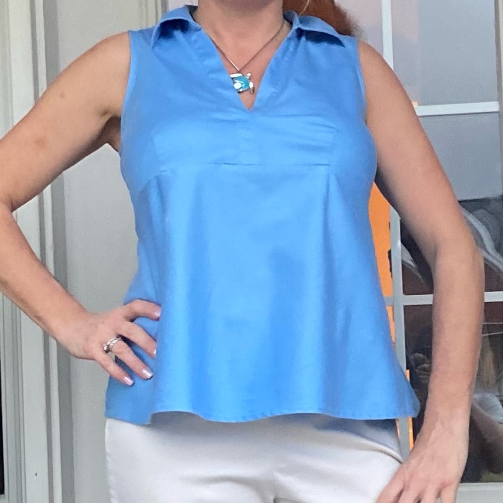 Motherhood Maternity Blue sleeveless blouse with back ties.